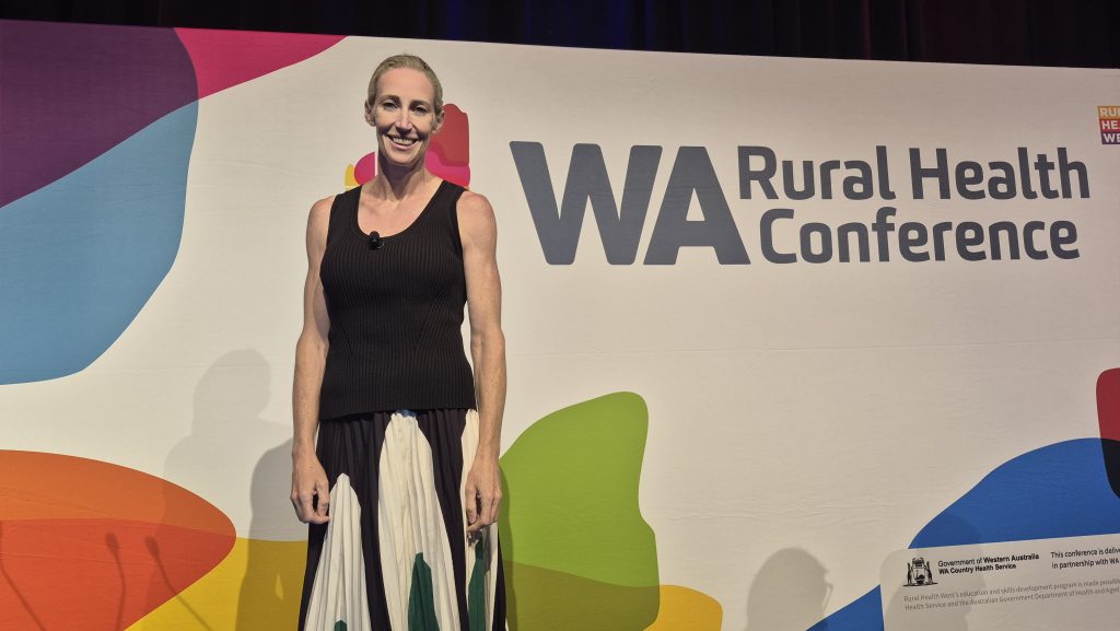 Woman on stage at the WA Rural Health Conference