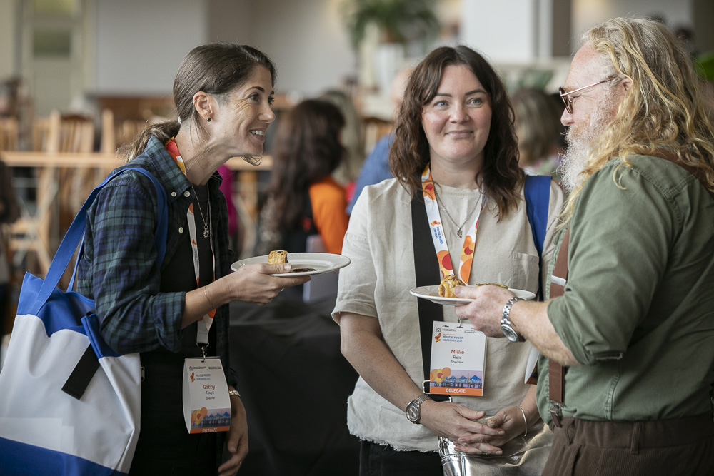 Three people chatting and an event