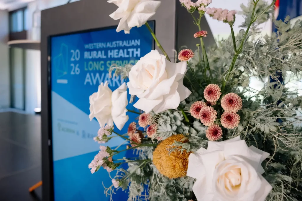 flowers in front of award banner