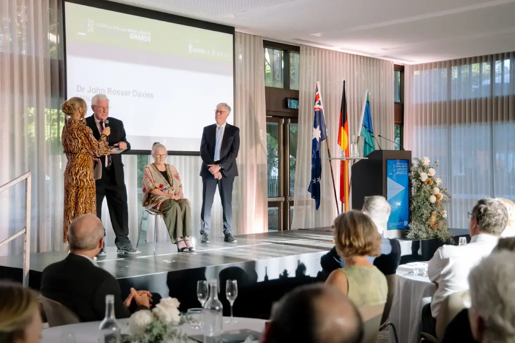 people talking on stage at the event